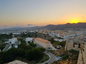 High angle view of cityscape against sky at sunset