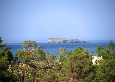 Scenic view of sea against clear blue sky