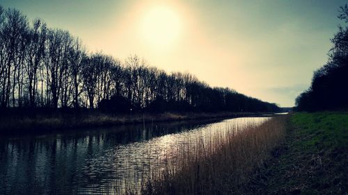 Scenic view of lake against sky during sunset