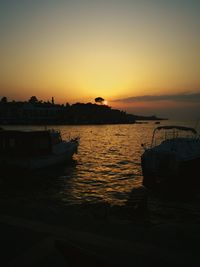 Scenic view of sea against orange sky