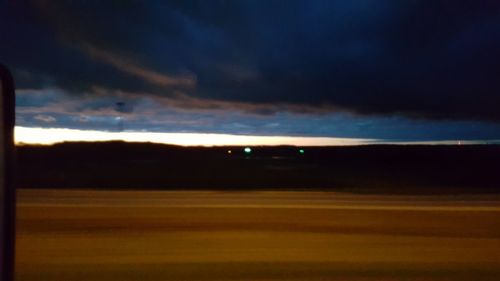 Scenic view of landscape against cloudy sky