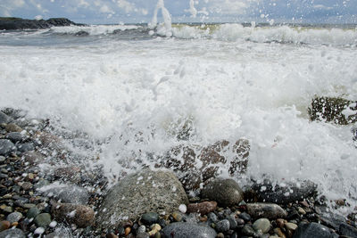 Waves splashing on rocks at shore