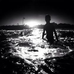 Woman standing on beach