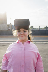 Smiling teenager with down syndrome wearing vr goggles