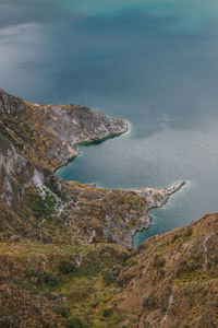 High angle view of rocks on sea shore