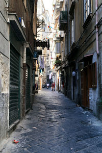 Narrow street amidst buildings in town