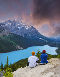 Rear view of man looking at lake