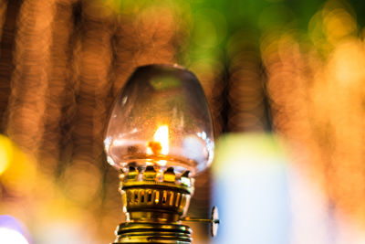 Close-up of illuminated oil lamp