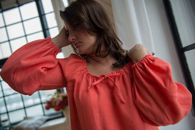 Close-up of young woman standing at home