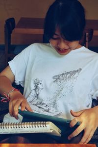 Close-up of girl playing piano