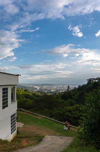 View of buildings in city against sky