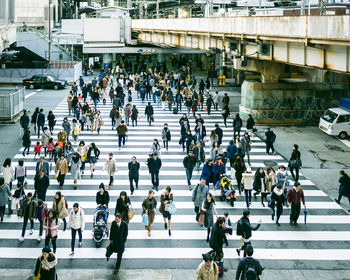 People walking on street in city during winter