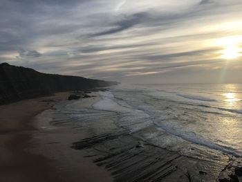 Scenic view of beach against sky