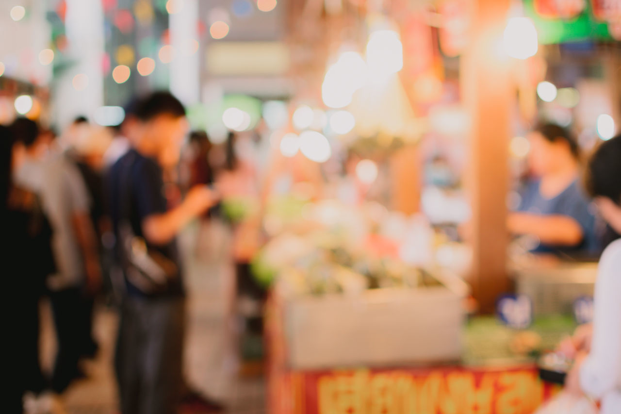 GROUP OF PEOPLE AT MARKET