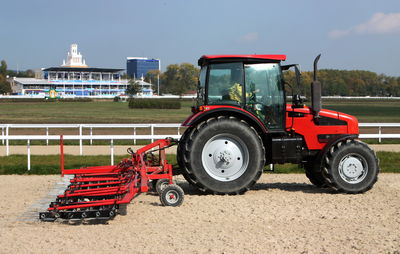 Tractor on field against sky