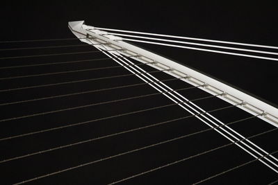 Low angle view of bridge against clear sky at night