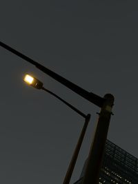 Low angle view of basketball hoop against clear sky