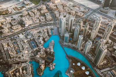 High angle view of swimming pool by buildings in city