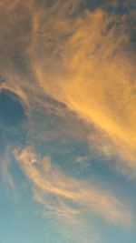 Low angle view of cloudy sky during sunset