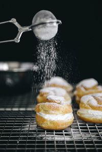 Close-up of powdered sugar sprinkling on desert