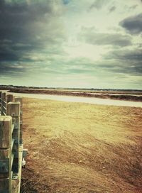 Scenic view of sea against cloudy sky