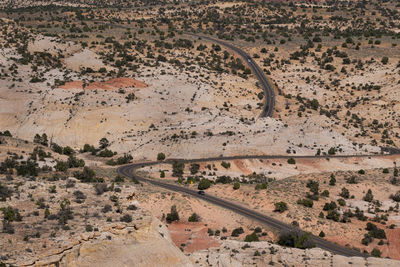 High angle view of winding road passing through a desert