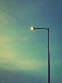 Low angle view of street light against sky