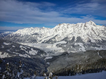 Scenic view of snowcapped mountains against sky