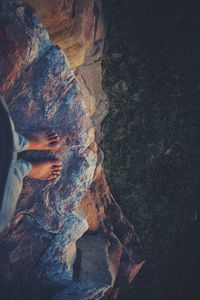 Low section of man on rock