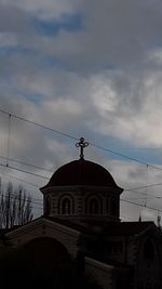 Church against sky in city