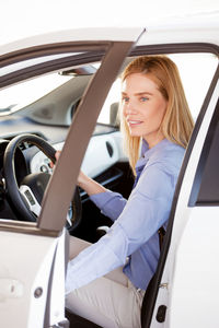 Close-up of woman sitting car