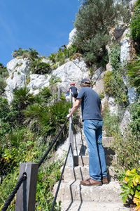 Family walking along the mediterranean steps footpath in gibraltar