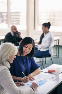 Adults working together in class