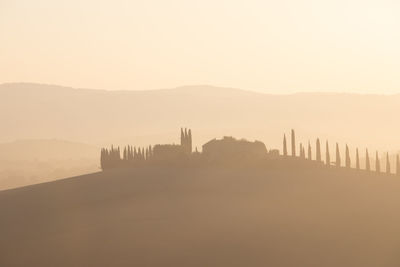 Scenic view of silhouette mountain against sky during sunset