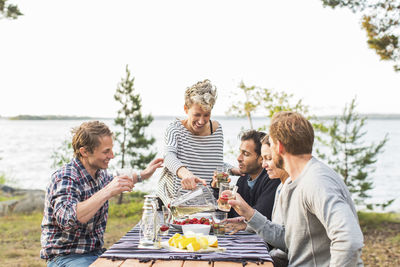 Group of people having food outdoors