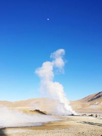 Hot spring against blue sky