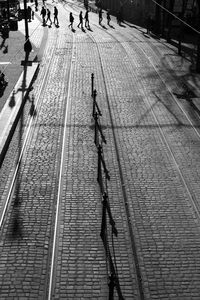 High angle view of people walking on footpath