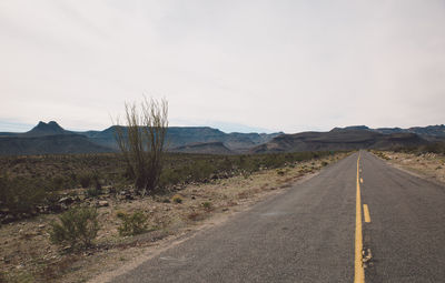 Road amidst landscape against sky