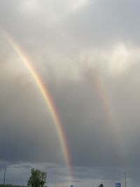 Low angle view of rainbow in sky