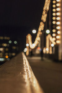 Defocused image of illuminated street lights at night