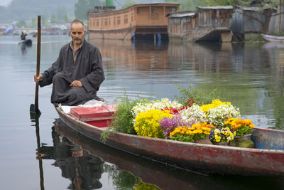Man sitting by lake
