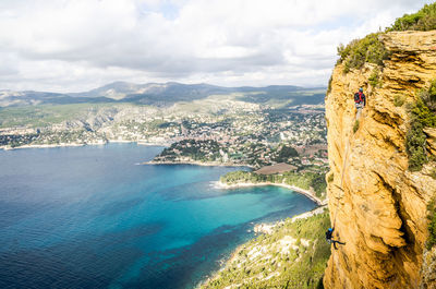 Aerial view of sea against cloudy sky