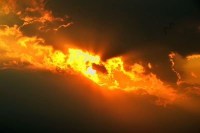 Low angle view of cloudy sky at sunset