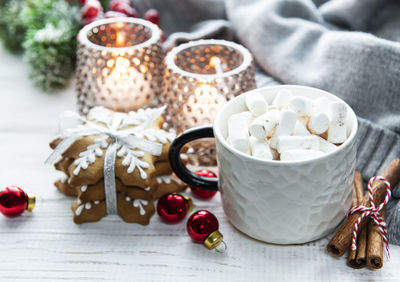 Christmas decorations, cocoa and gingerbread cookies.