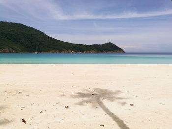 Scenic view of beach against sky