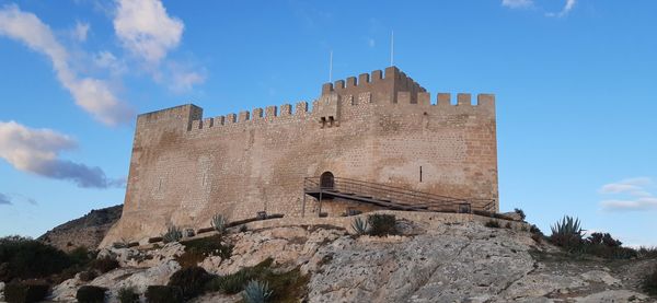 Low angle view of fort against sky