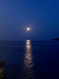 Scenic view of sea against sky at night