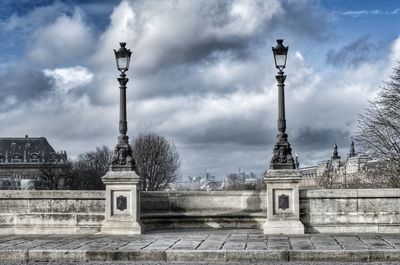 Statue of building against cloudy sky