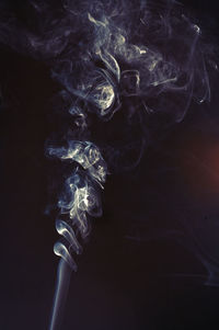 Close-up of smoke against black background