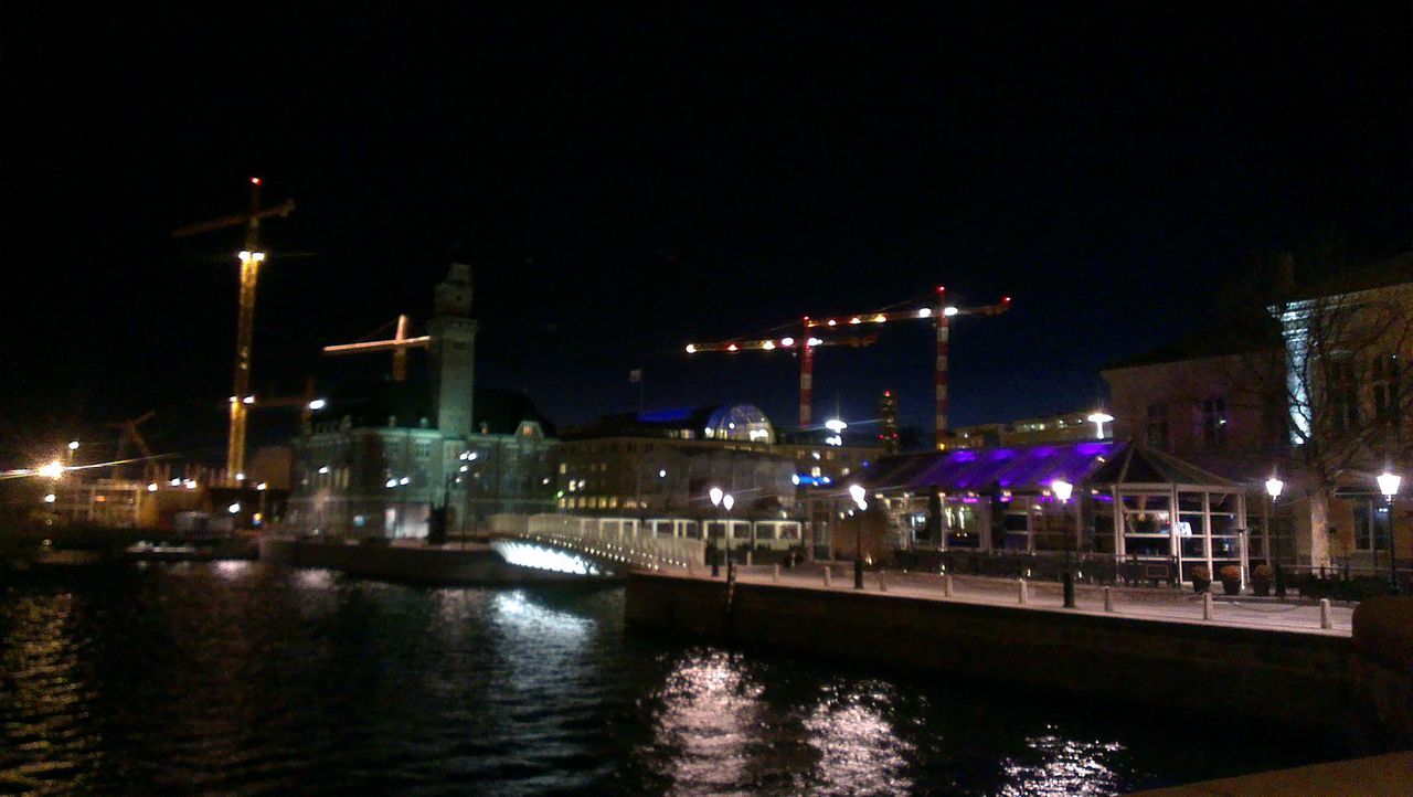 night, illuminated, architecture, building exterior, built structure, water, waterfront, street light, city, river, reflection, transportation, lighting equipment, clear sky, sky, crane - construction machinery, nautical vessel, industry, outdoors, no people